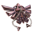 Détail des pièces métalliques du puzzle Hyrule Crest Zelda

