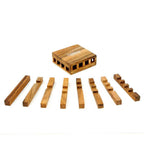 Puzzle Chip en bois démonté montrant les 9 pièces
